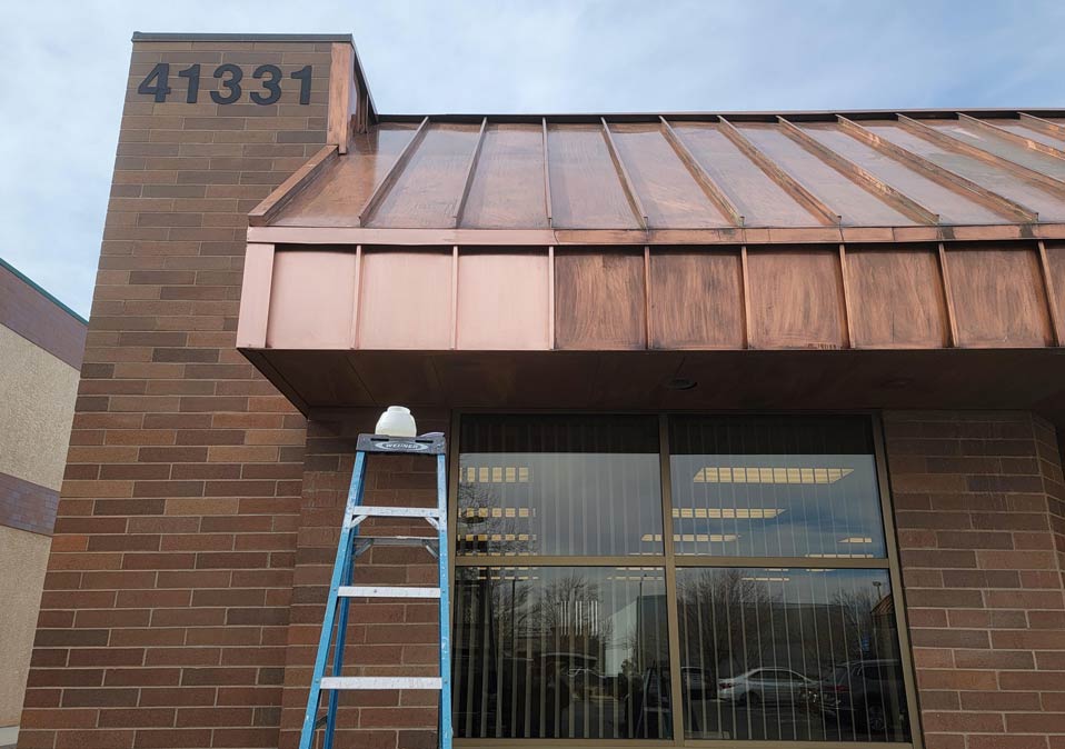 vtbuildingMetaldoorServicesCopperRoof